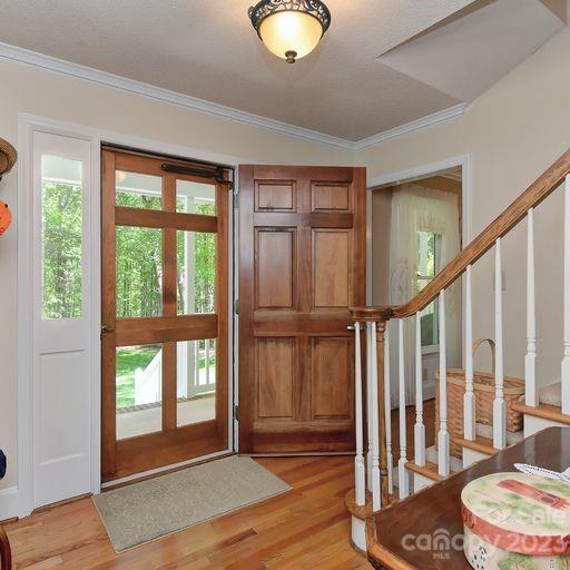 900 Woodland Forest Road Marvin, NC 28173 - Photo 2 of 36 a view of entryway with wooden floor and windows