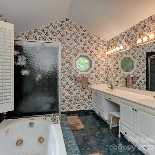 900 Woodland Forest Road Marvin, NC 28173 - Photo 21 of 36 a bathroom with a sink and a mirror