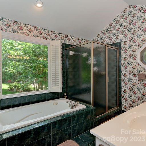 900 Woodland Forest Road Marvin, NC 28173 - Photo 22 of 36 a bathroom with a bathtub and a shower