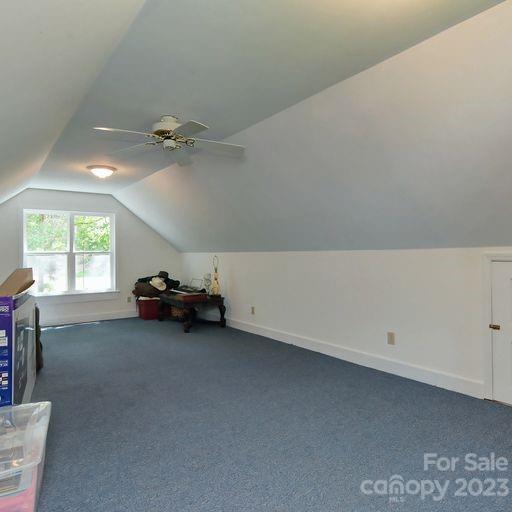 900 Woodland Forest Road Marvin, NC 28173 - Photo 27 of 36 a view of a livingroom with furniture and a ceiling fan
