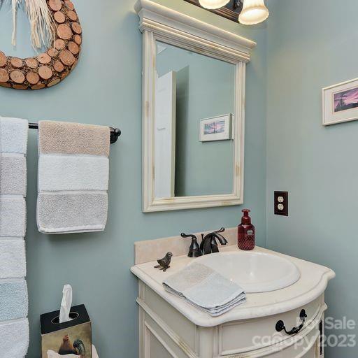 900 Woodland Forest Road Marvin, NC 28173 - Photo 28 of 36 a bathroom with a sink and a mirror