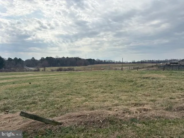 a view of a lake with houses in the back
