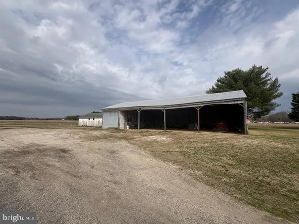 a view of a house with a yard and garage