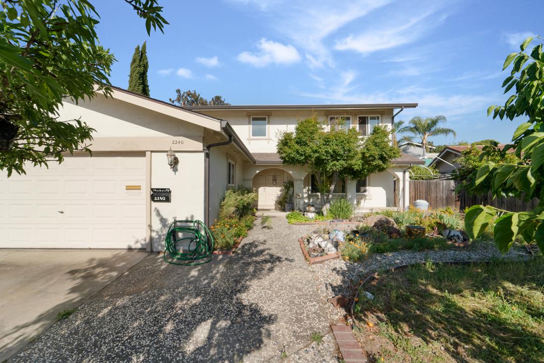 2240 Ruby Avenue San Jose, CA 95148 - Photo 13 of 18 a front view of a house with garden