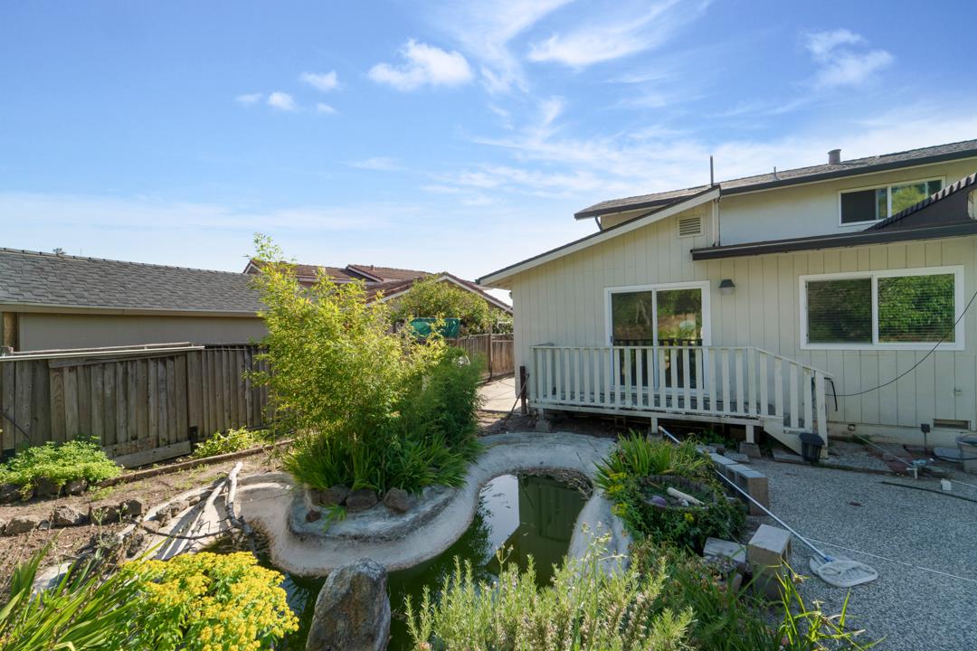 2240 Ruby Avenue San Jose, CA 95148 - Photo 10 of 18 a view of a house with a yard and potted plants