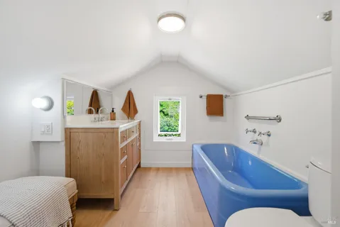 a bedroom with a bed and a view of bedroom