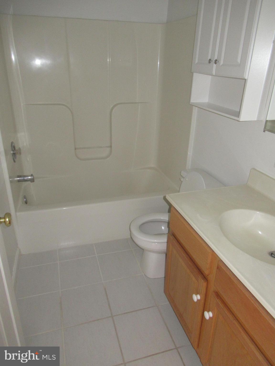 436 Coates Street Bridgeport, PA 19405 - Photo 14 of 20 a bathroom with a granite countertop sink a toilet and bathtub