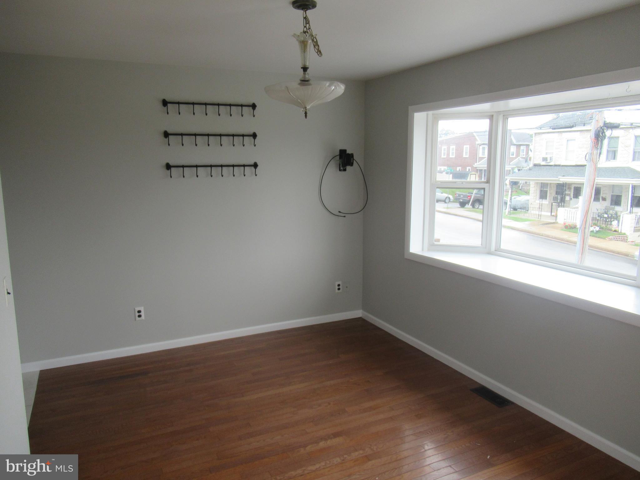 436 Coates Street Bridgeport, PA 19405 - Photo 4 of 20 wooden floor in an empty room with a window