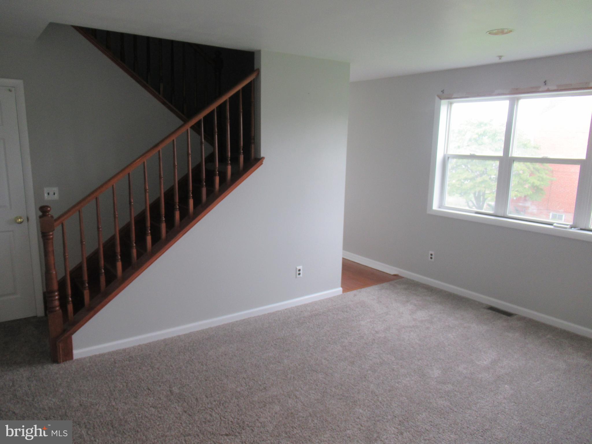 436 Coates Street Bridgeport, PA 19405 - Photo 8 of 20 a view of an empty room with stairs