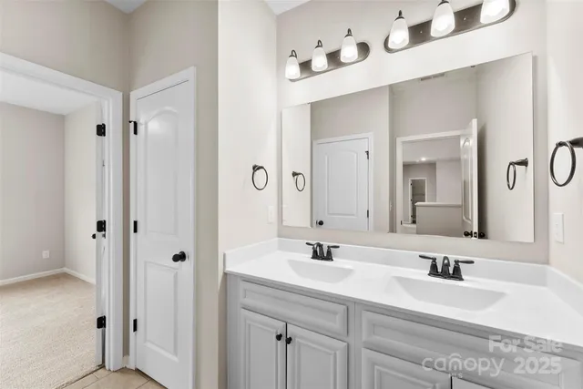 a bathroom with a double vanity sink mirror and double