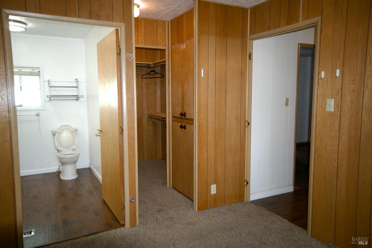 211 Colonial Park Drive Santa Rosa, CA 95403 - Photo 24 of 26 Walk in closet, bath, and door to hallway in main bedroom