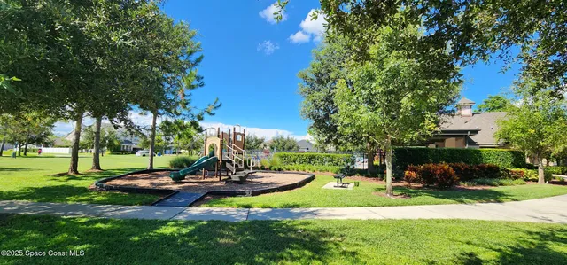 a view of a park with large trees