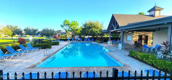 a view of an chairs and table in the patio