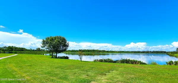 a view of a lake with a big yard