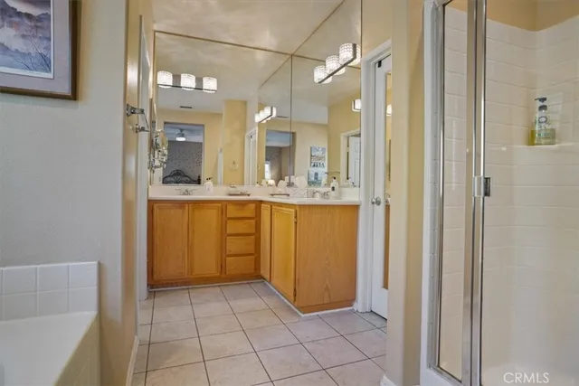 a view of a bathroom with a shower and a sink