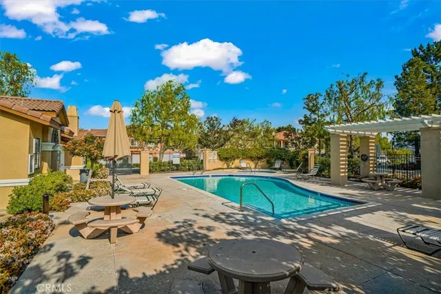 a view of a swimming pool with a patio