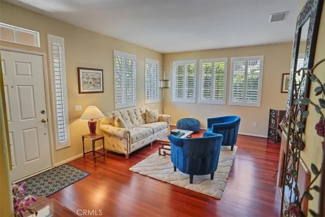 a living room with furniture and a rug