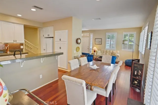 a view of a dining room with furniture and window