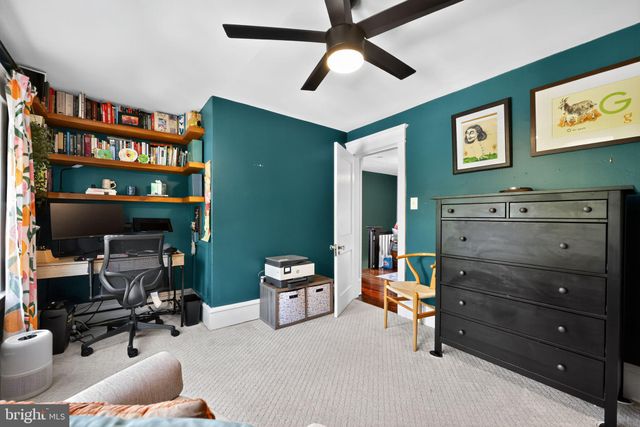 a room with furniture cabinets and a window