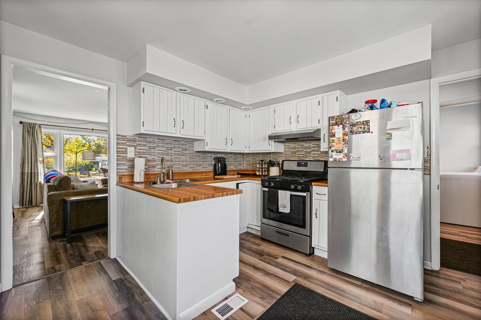 1608 Sheridan Road Champaign, IL 61821 - Photo 13 of 29 a kitchen with stainless steel appliances granite countertop a refrigerator stove and sink