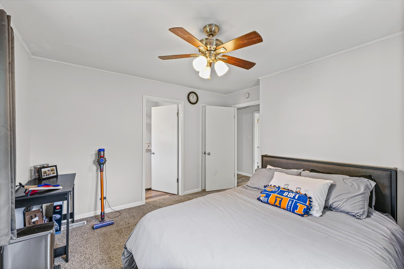 1608 Sheridan Road Champaign, IL 61821 - Photo 17 of 29 a bedroom with a bed and a chandelier