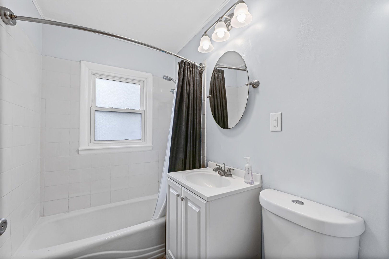 1608 Sheridan Road Champaign, IL 61821 - Photo 18 of 29 a bathroom with a toilet sink and mirror