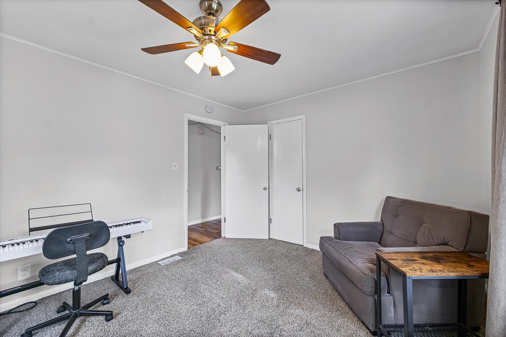 1608 Sheridan Road Champaign, IL 61821 - Photo 20 of 29 a living room with furniture and a ceiling fan