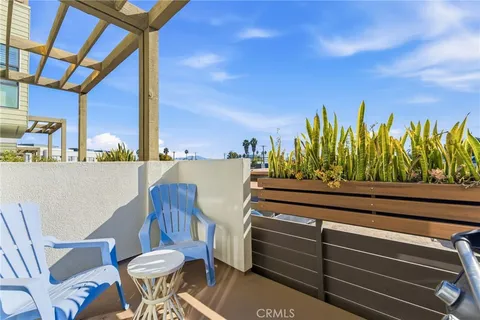 a view of a chairs and table in a patio
