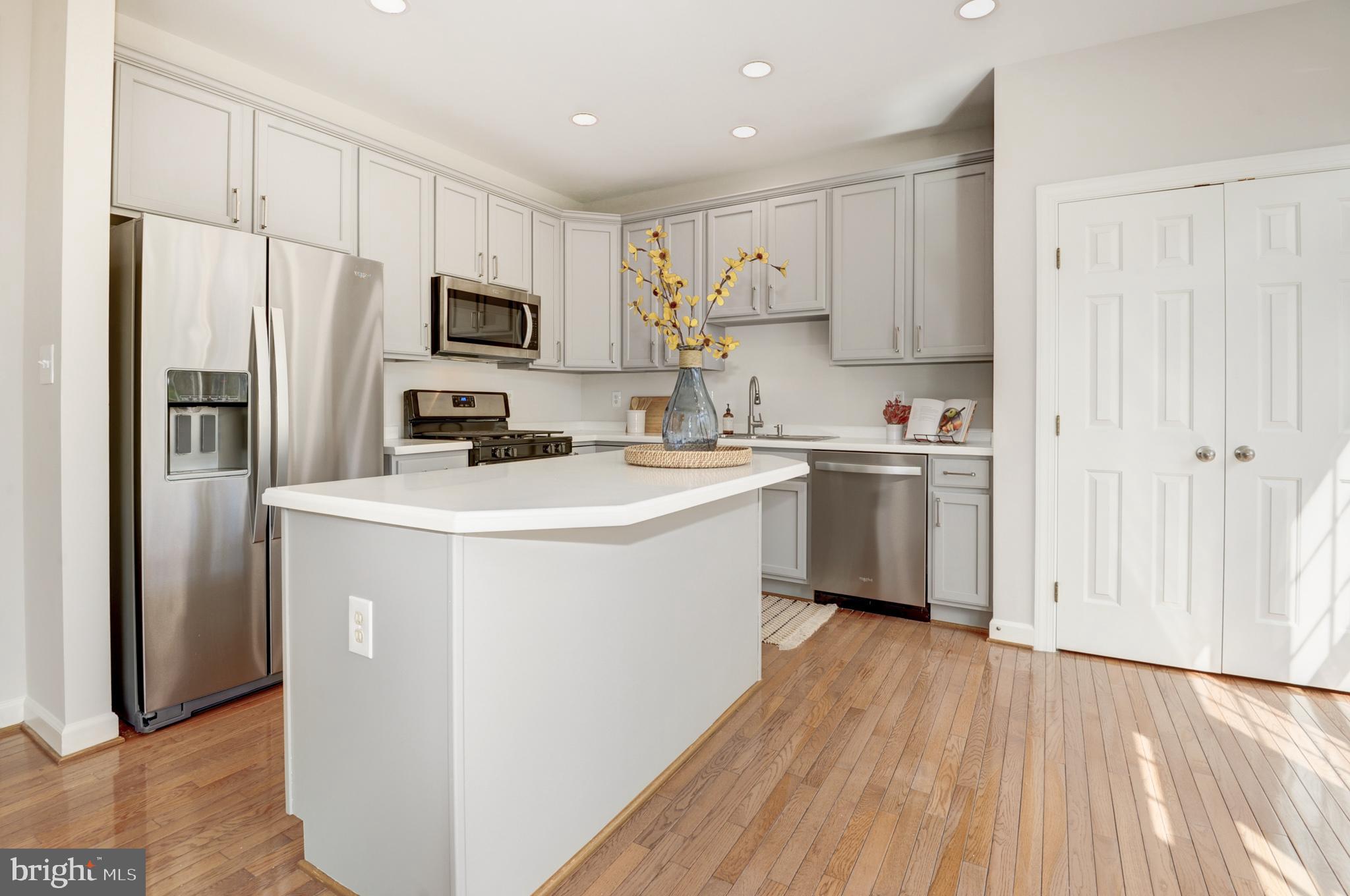 6489 Topsails Lane Springfield, VA 22150 - Photo 8 of 28 Seated Kitchen Island and Pantry