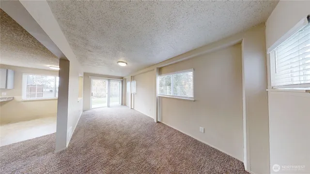 a view of empty room with windows