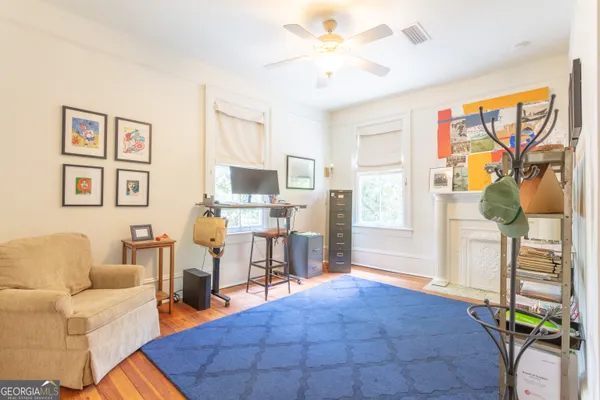 a bedroom with a bed and a tv
