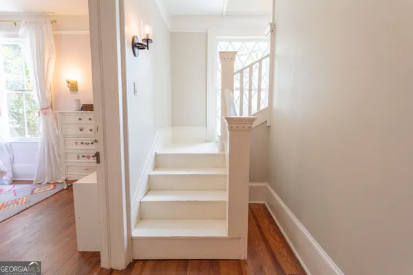 a bedroom with a bed and a bookshelf