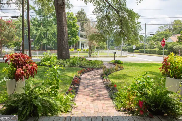 a view of a garden with a fountain