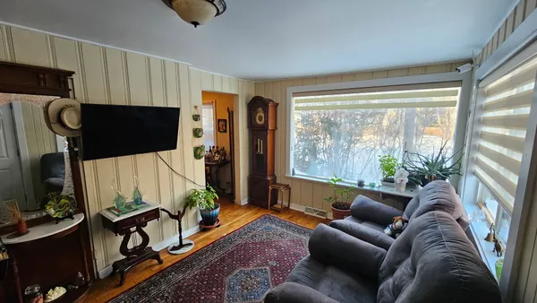 a living room with furniture fireplace and a flat screen tv
