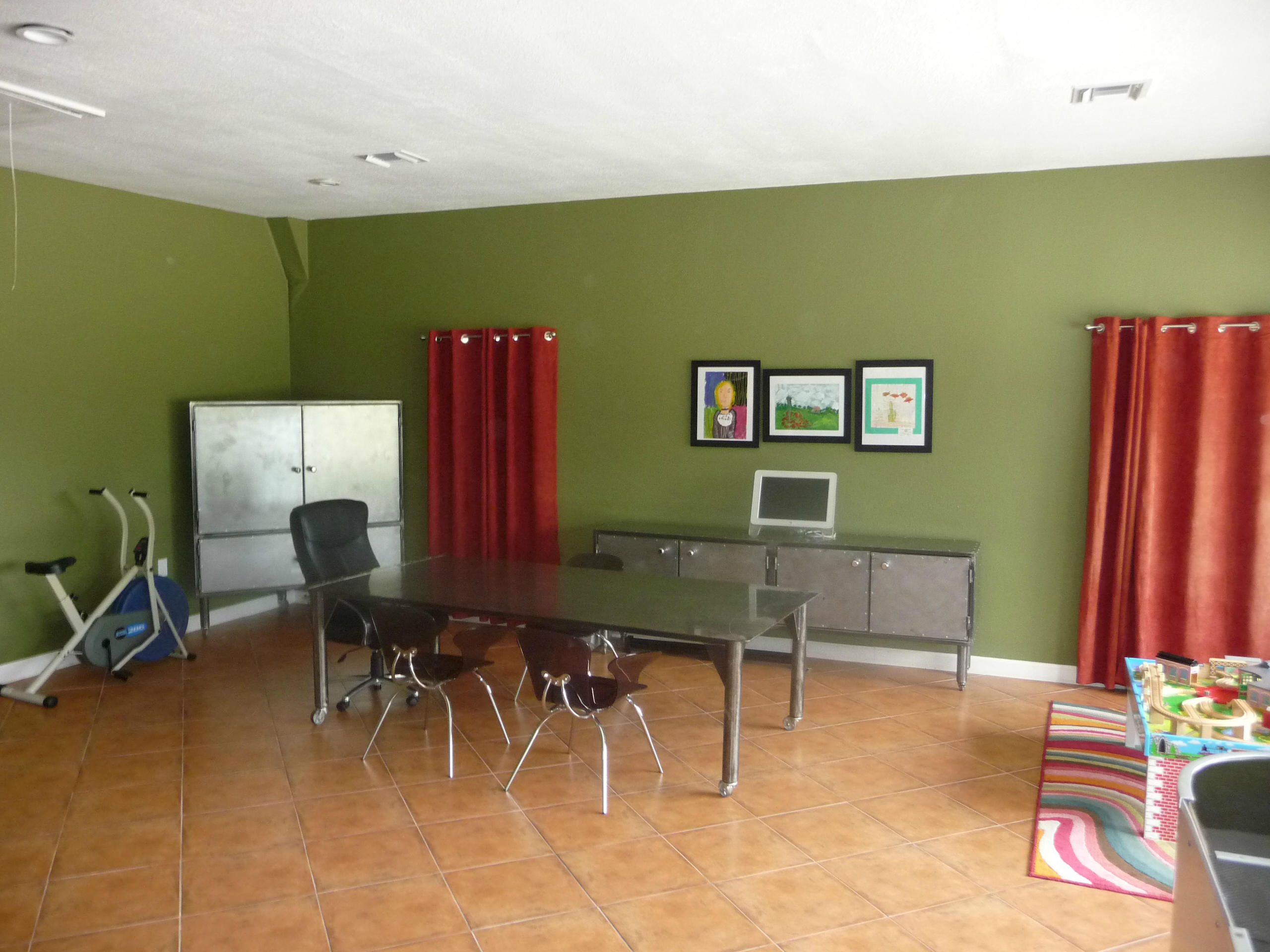 19655 118th Trail South, Unit FRNT Boca Raton, FL 33498 - Photo 14 of 31 a living room with furniture and a flat screen tv