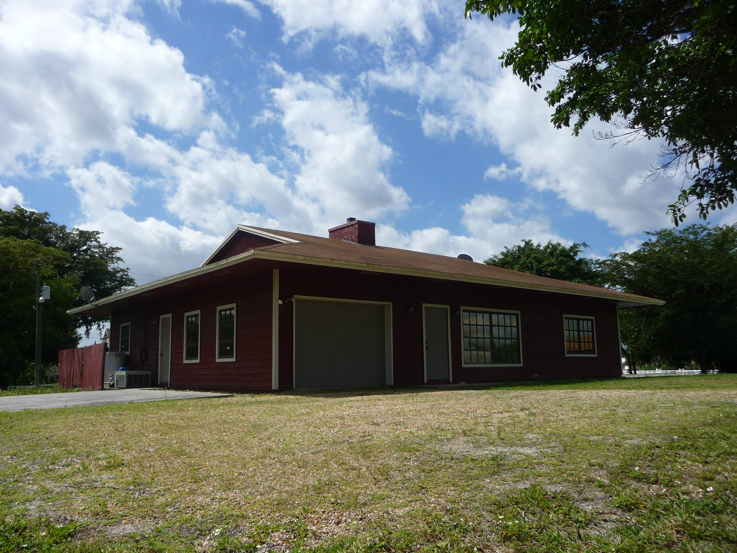 19655 118th Trail South, Unit FRNT Boca Raton, FL 33498 - Photo 21 of 31 a front view of a house with a yard