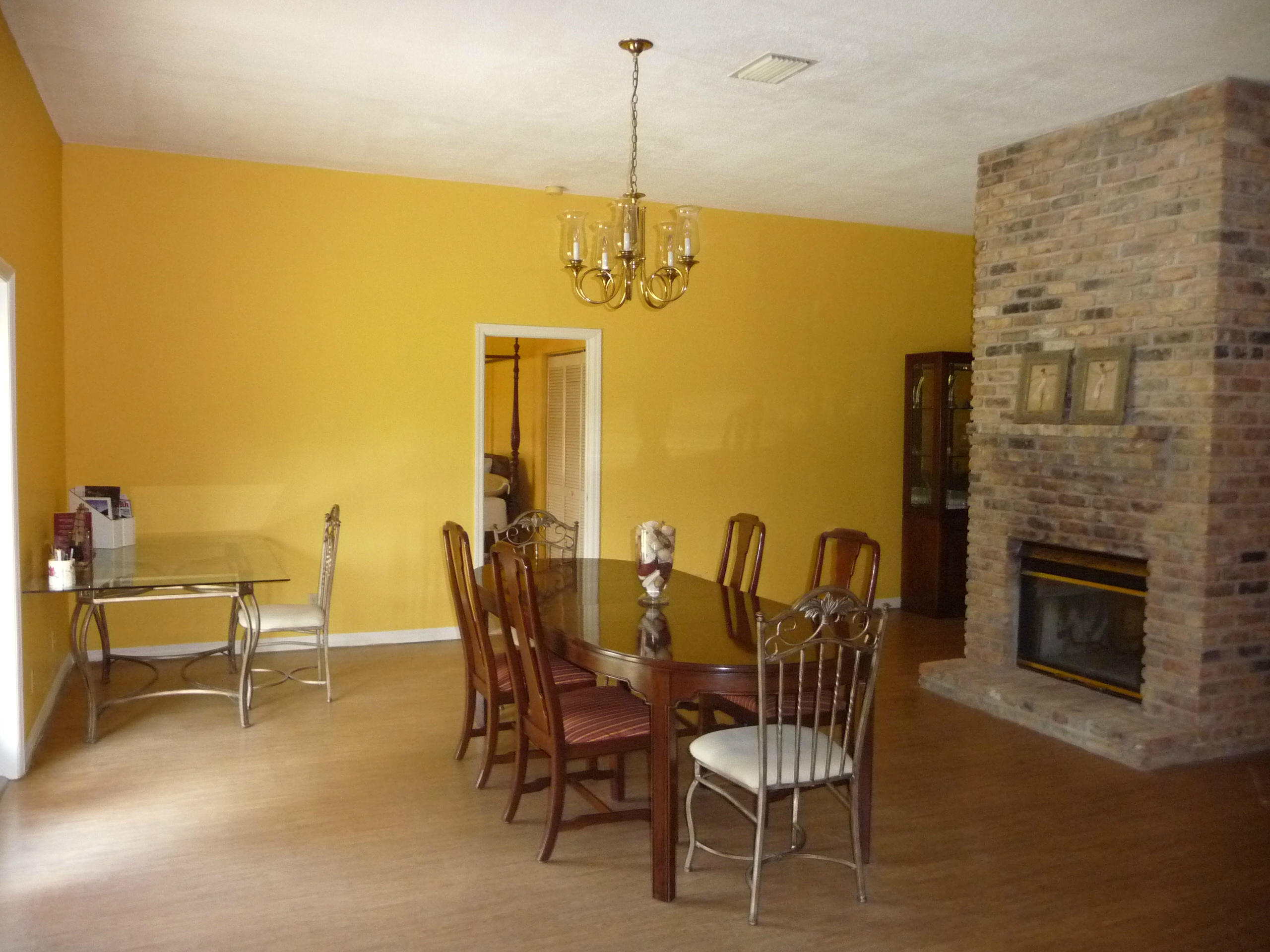 19655 118th Trail South, Unit FRNT Boca Raton, FL 33498 - Photo 24 of 31 a dining room with furniture and a fireplace