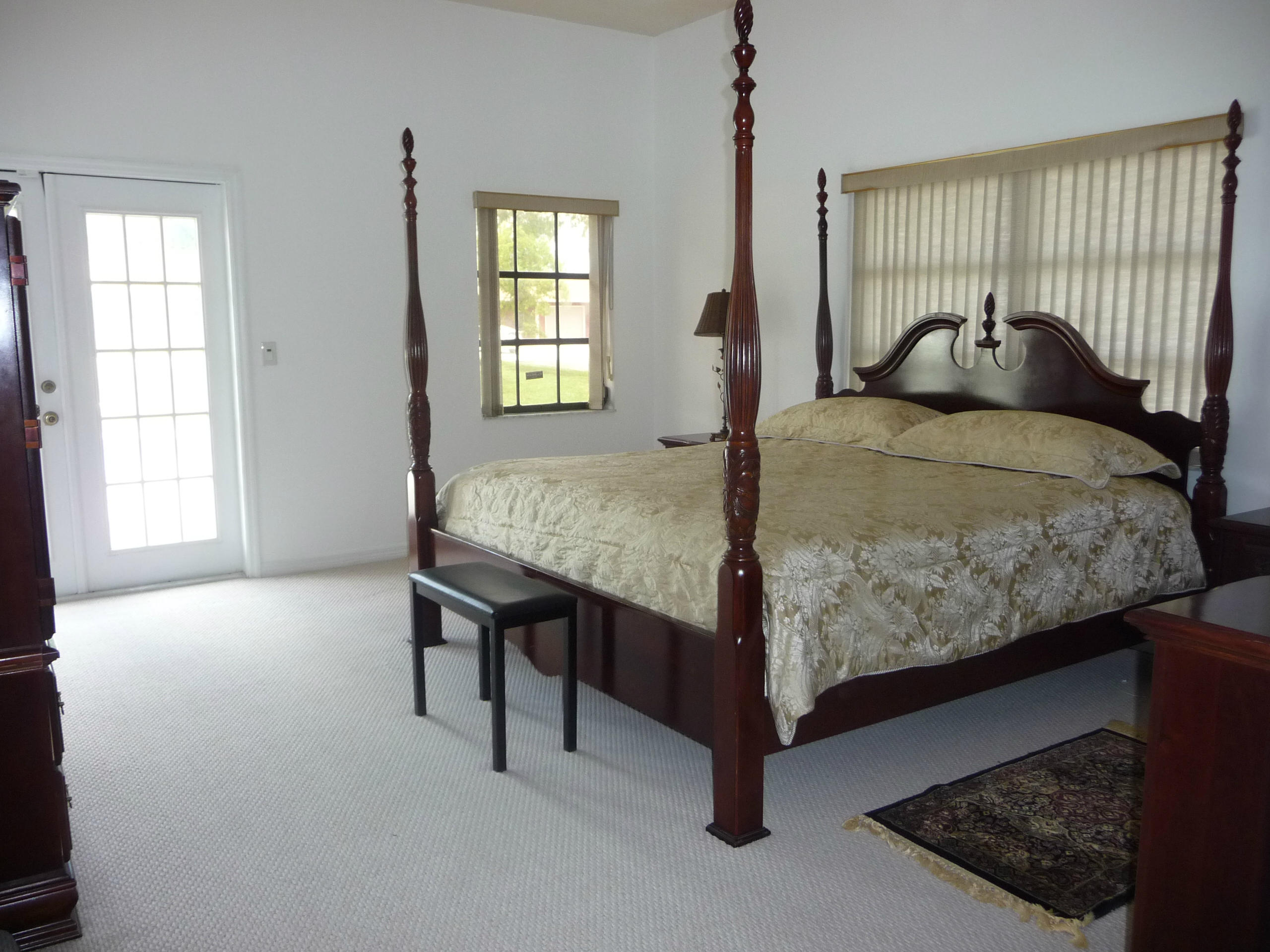 19655 118th Trail South, Unit FRNT Boca Raton, FL 33498 - Photo 25 of 31 a bedroom with a bed and window
