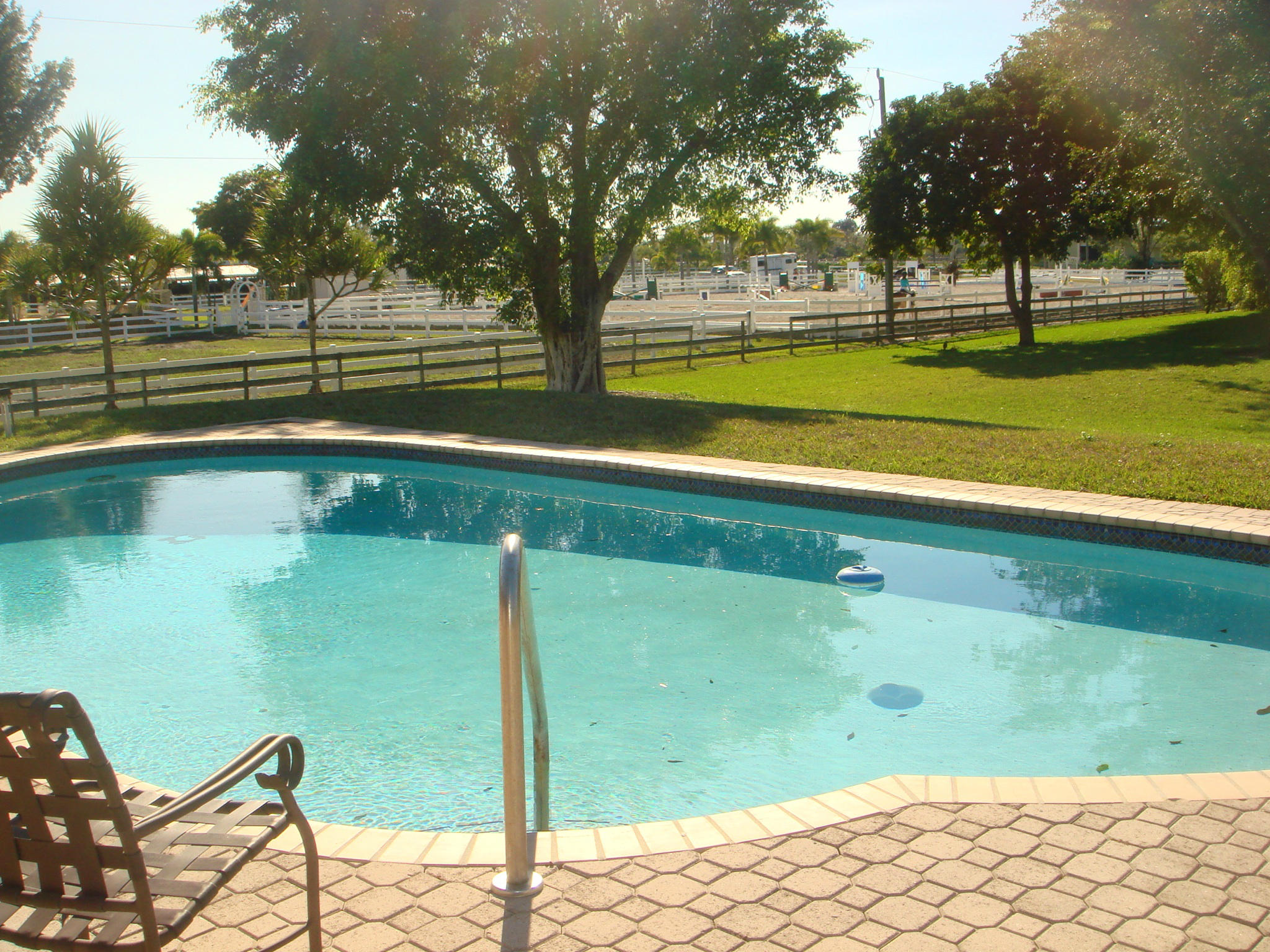 19655 118th Trail South, Unit FRNT Boca Raton, FL 33498 - Photo 27 of 31 a view of a yard with an outdoor space