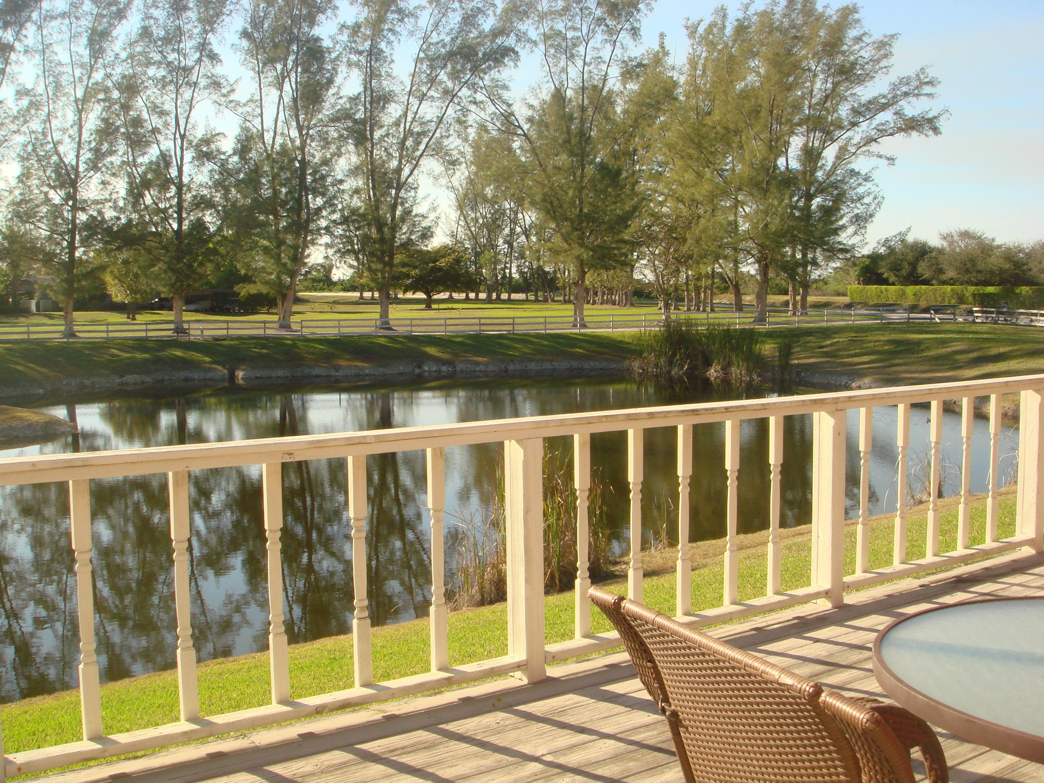 19655 118th Trail South, Unit FRNT Boca Raton, FL 33498 - Photo 4 of 31 a view of lake with a big yard