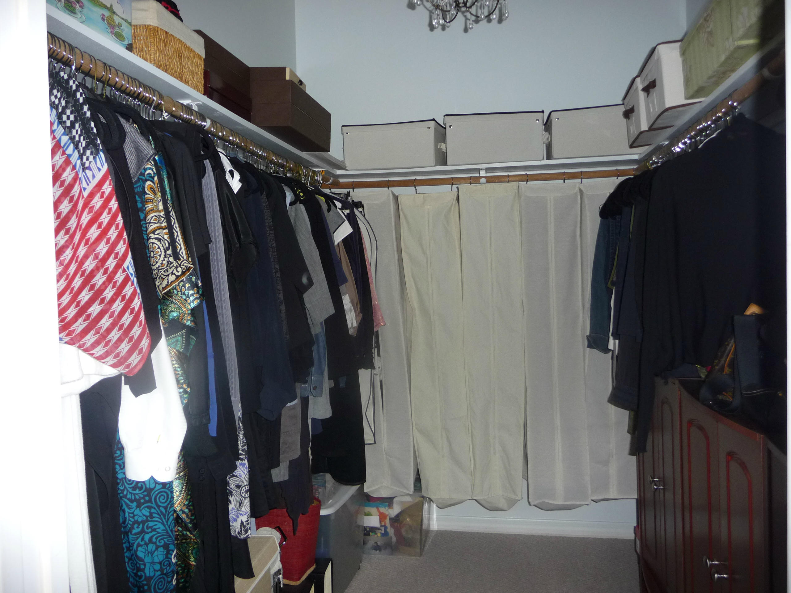 19655 118th Trail South, Unit FRNT Boca Raton, FL 33498 - Photo 10 of 31 a view of walk in closet with clothes and shoes