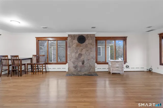 a view of fireplace with dining area