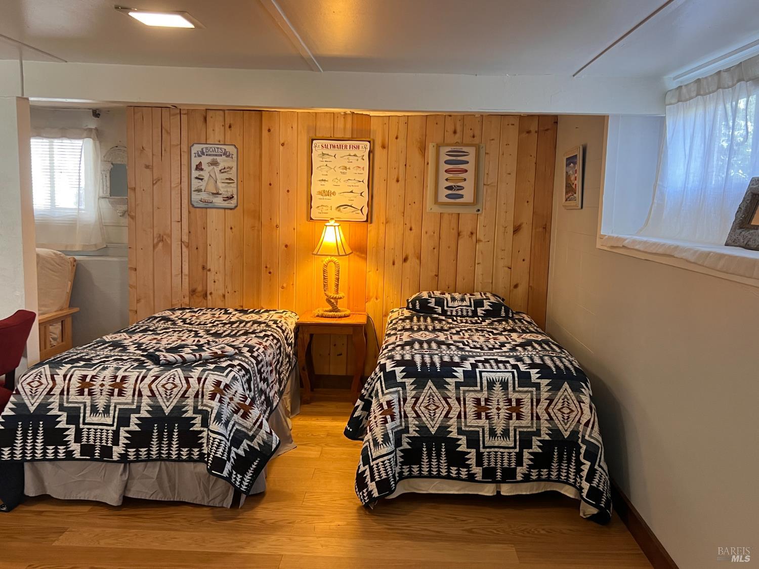 75 Ocean View Avenue Dillon Beach, CA 94929 - Photo 18 of 30 a bedroom with two beds and painted walls