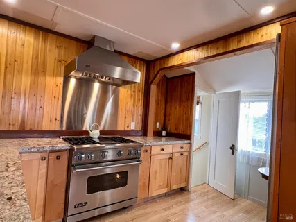 a kitchen with stainless steel appliances a stove and a refrigerator