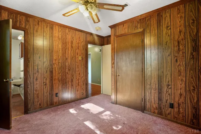 a view of an empty room with a fireplace