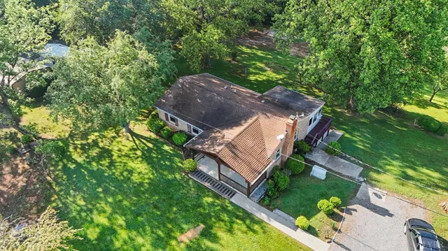 a view of a park with large trees