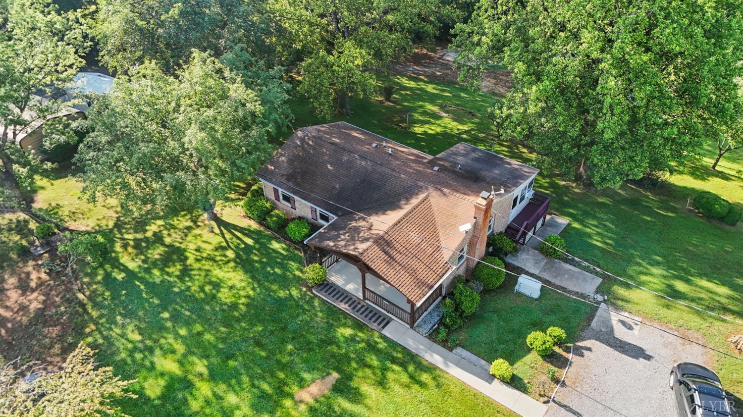 2294 High Peak Road Monroe, VA 24574 - Photo 34 of 53 a view of a house with a yard and a large tree