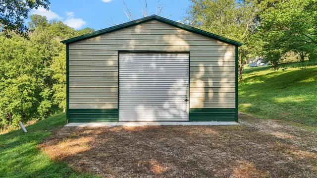a view of a backyard with large trees
