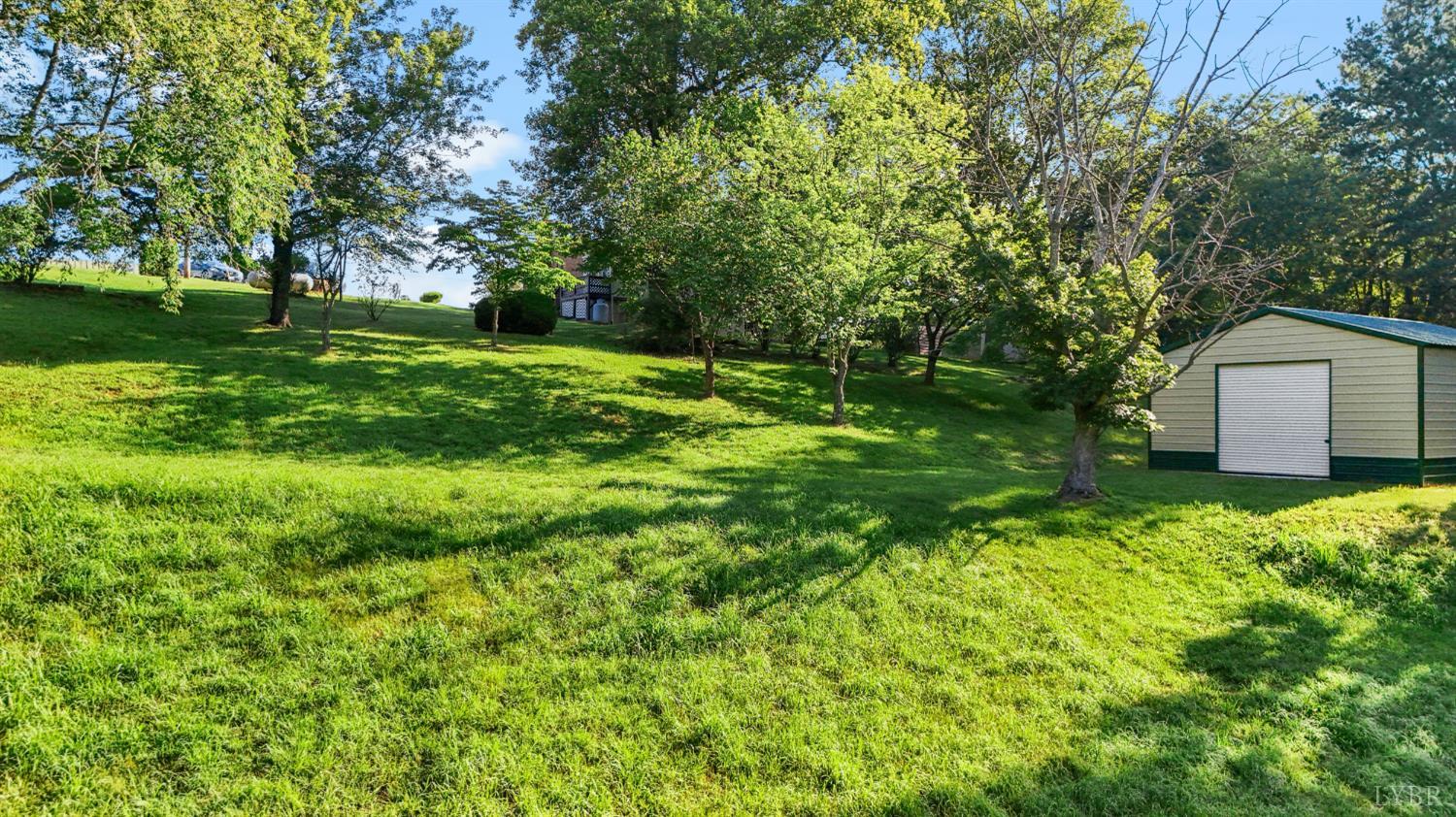 2294 High Peak Road Monroe, VA 24574 - Photo 39 of 53 a view of a backyard with large trees