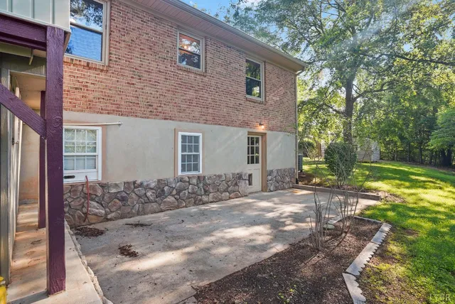 a wooden bench sitting in the middle of a forest